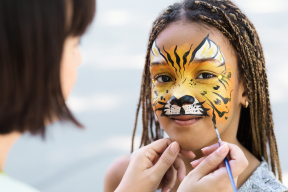 Child having her face painted